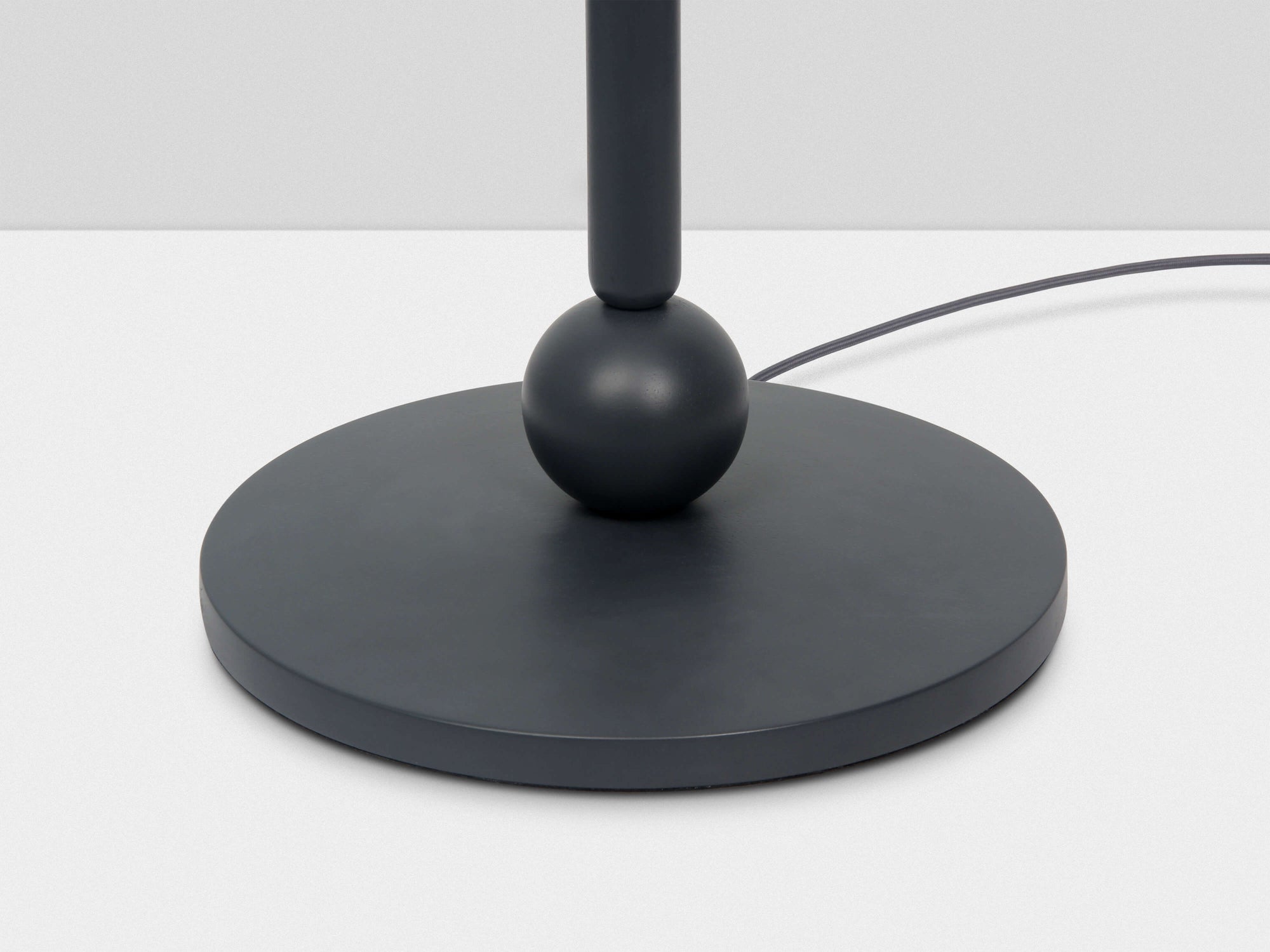 Charcoal grey turned wood floor lamp